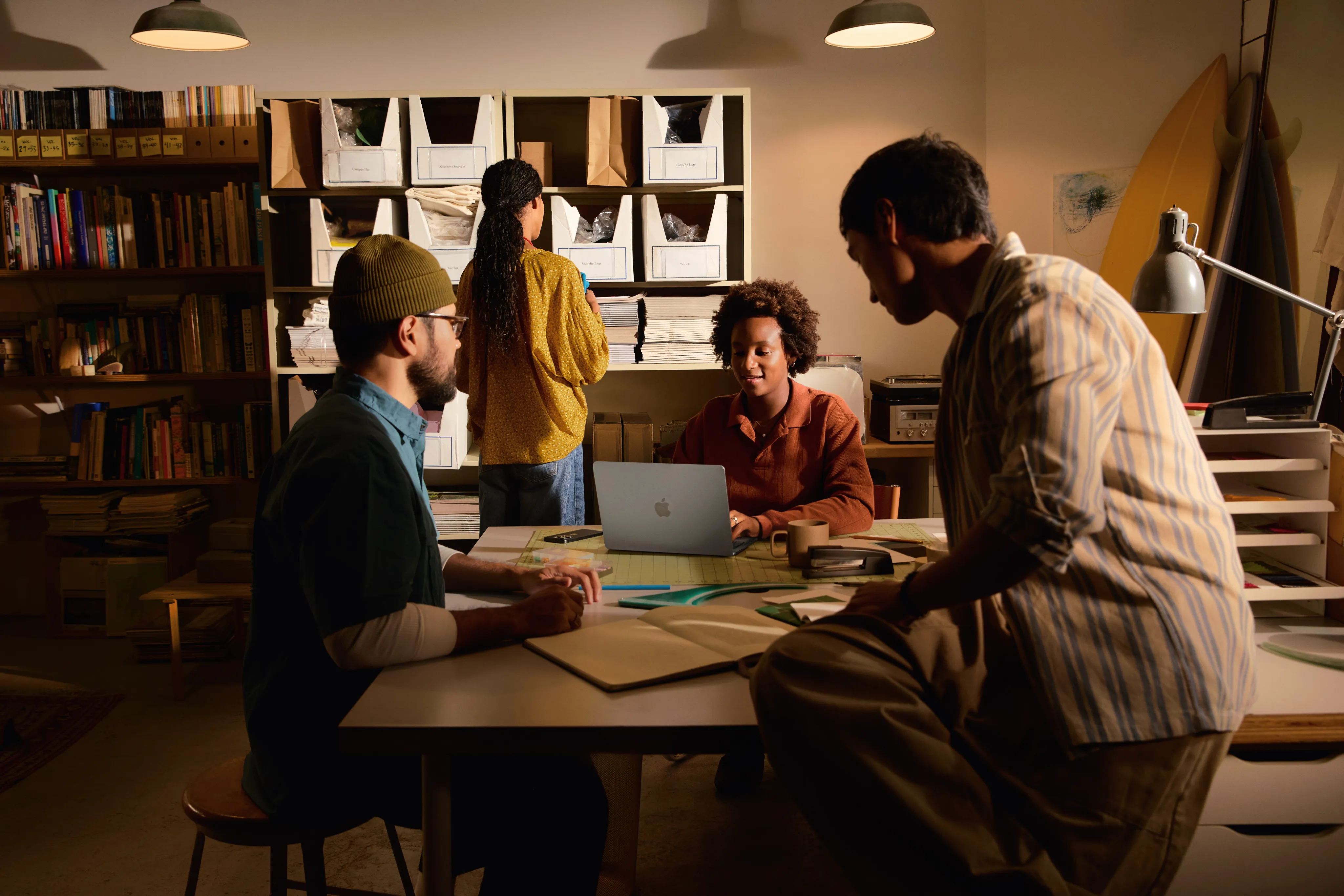A team collaborating around a table in a creative studio